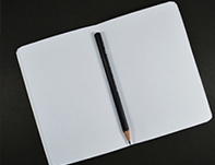A blank notebook symbolizing writer's block. Improv is used by creatives in the advertising industry to beat writer's block.