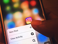 The Instagram app shown on a smartphone. Here's how the latest Instagram update could affect your brand